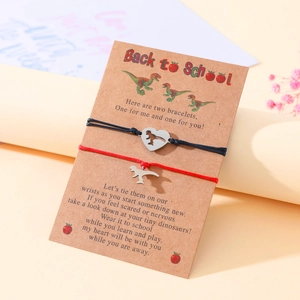 Detail of dinosaur heart bracelets on 'Back to School' gift card for mother and daughter