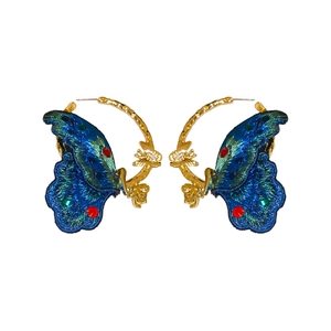 Vintage embroidered butterfly hoop earrings with blue gradients and gold bamboo texture