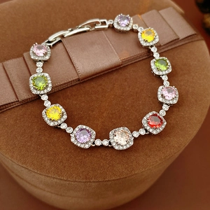 Detail of vintage round zircon bracelet on brown velvet gift box with ribbon