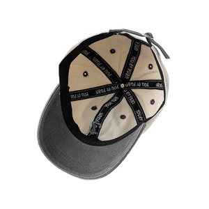 Internal view of toddler cotton baseball cap with adjustable metal buckle and contrast brim