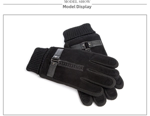 Detail view of winter gloves with ribbed knit cuffs and decorative metal rivet buckle