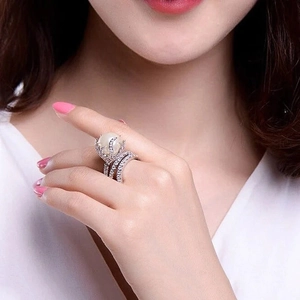 Elegant silver crown ring featuring a large white pearl and brilliant pave-set zircon stones