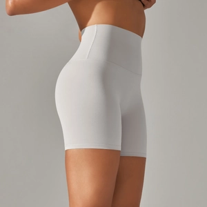 Detail of high waisted yoga shorts showing side reinforced stitching and matte fabric
