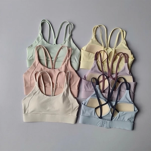 High-impact sports bras in pastel colors with cross back straps and adjustable hooks