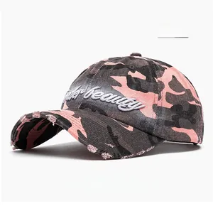 Detail of pink camouflage baseball cap with 3D beauty embroidery and distressed brim