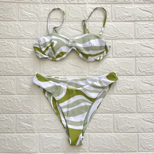 Detailed flat lay of zebra print bikini with wired top and high-cut bottom in olive green