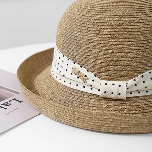 Hepburn style straw sun hat with polka dot ribbon and gold music metal accent