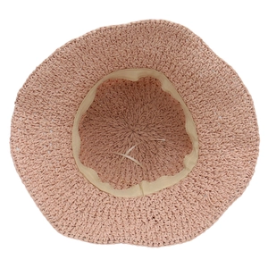 Elegant foldable summer straw sun hat with bow tie in soft pink for women beach trips
