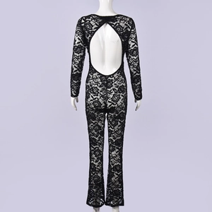 Detail of black lace jumpsuit with backless cutout design and sheer long sleeves
