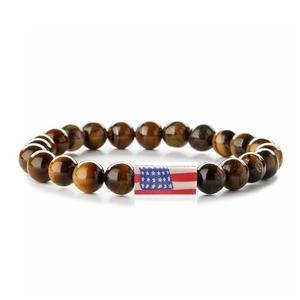 Macro shot of tiger eye stone beads bracelet featuring a central USA flag rectangle bead