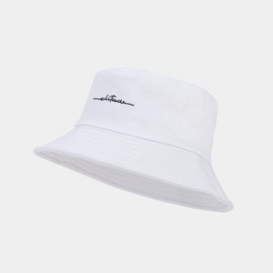 Minimalist white bucket hat featuring black 'whatever' script embroidery for casual wear
