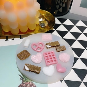 Silicone mold featuring heart, milk, and cookie shapes for DIY resin and baking crafts