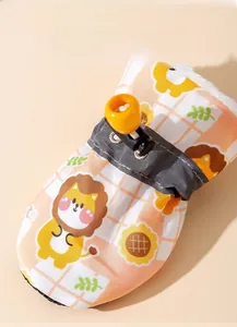 Detail of dog boots with orange plaid lion pattern and warm sherpa lining with drawstring