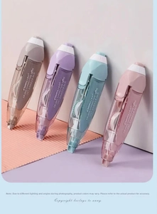 Close-up of four Morandi colored retractable correction tapes with ergonomic translucent grip