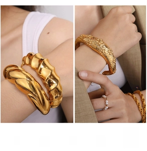 Detailed macro view of gold chunky bracelets and pearl rings with irregular lava texture