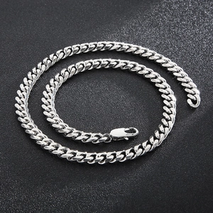 Detailed close-up of a silver stainless steel Cuban link necklace with lobster clasp
