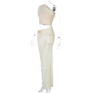 Detail of cream mesh two-piece set featuring asymmetrical pleated top and bodycon skirt