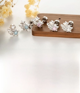 Detail of silver star wing earring with titanium steel post and zircon inlay specifics