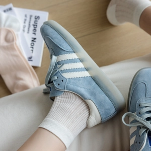 Blue suede casual sneakers with white stripes paired with breathable mesh cotton socks