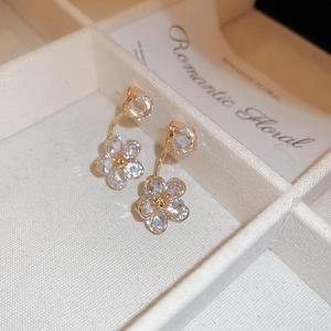 Elegant gold flower stud earrings with sparkling crystals and pear-shaped petals