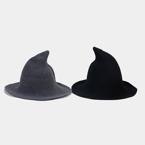 Detail of knitted Halloween witch hats in black and gray showing high-quality fabric texture