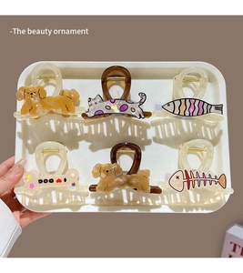 Detail of 6pcs cute cartoon cat and dog hair claws made of premium acetate in a tray