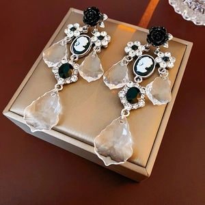 Vintage floral portrait drop earrings with black roses and crystals on gold box