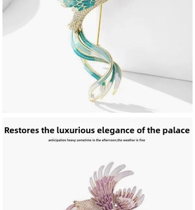 Detailed macro view of vintage phoenix enamel brooches with crystal inlay and gold finish