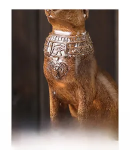 Detail of Egyptian cat statue showing intricate collar with Eye of Horus and textures