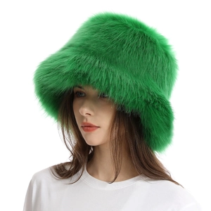 Detailed view of thick green faux fur texture on a warm winter bucket hat