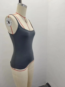 Detail view of the gray slim-fit tank top made of soft fabric on a mannequin