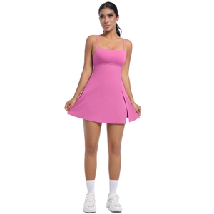 Detail view of pink athletic dress with thin spaghetti straps and elegant side slit