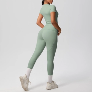 Slim fit sage green yoga set with side pockets on high-waist leggings and short sleeve top