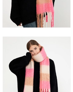 Close-up of winter plaid tassel scarf in pink and beige soft imitation cashmere material
