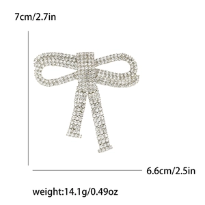 Silver bow brooch with rhinestones including size 7x6.6cm and weight 14.1g details