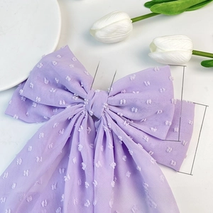 Detail view of purple chiffon bow hair clip with swiss dots and size dimensions