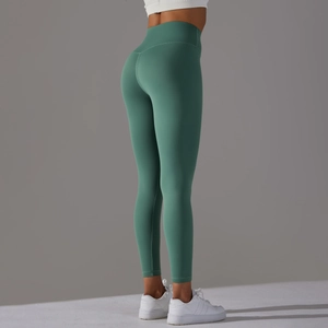 Close-up detail of high-waist Morandi green yoga pants showing seamless fabric and stitching