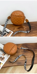 Detail of caramel brown round quilted crossbody bag with stylish wide jacquard strap