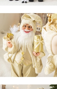 Close-up of Santa Claus figurine in light gold tones with a gift box and white beard