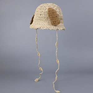 Close-up of handmade crochet dog-ear hat showing soft cotton weave and dark brown ears