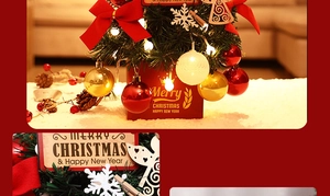 Close-up of mini Christmas tree with LED lights, red bows and festive ornaments