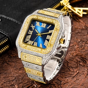 Detailed close-up of iced-out two-tone square watch with blue dial and roman numerals