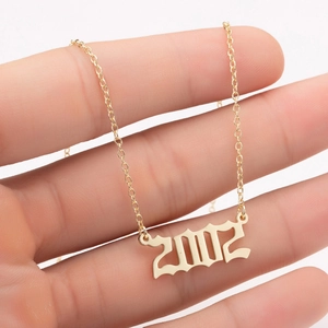 Gold stainless steel gothic year necklace featuring 2002 pendant on an O-chain