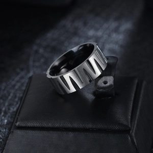 Men's wide brushed titanium steel ring with geometric serrated design on leather box