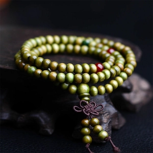 Handcrafted 8mm sandalwood Buddhist prayer beads with red accents and Chinese knot cord