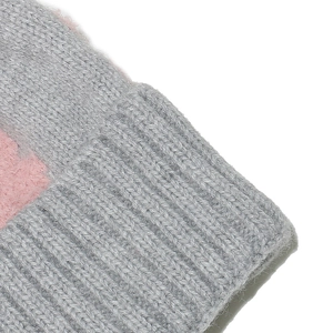 Close-up of gray knit winter hat featuring soft mohair texture and pink ribbed edge