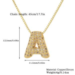 Detail view of gold letter A pendant with zircon inlay and product specifications