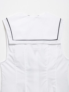 Detail of white sleeveless top with sailor collar and black contrast edge on back