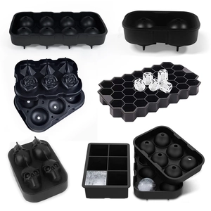 Set of black silicone ice cube trays for spheres, diamonds, and hexagonal ice shapes