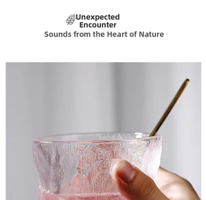 Pink glacier texture glass cup with gold stirrer and elegant wavy rim detail